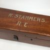 Antique wooden telescope box with name painted on the lid and damage to base panel