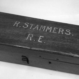Antique wooden telescope box with name painted on the lid and damage to base panel